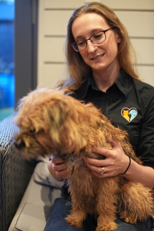 Dr Samantah Webster of Joii Pet Care holding a dog