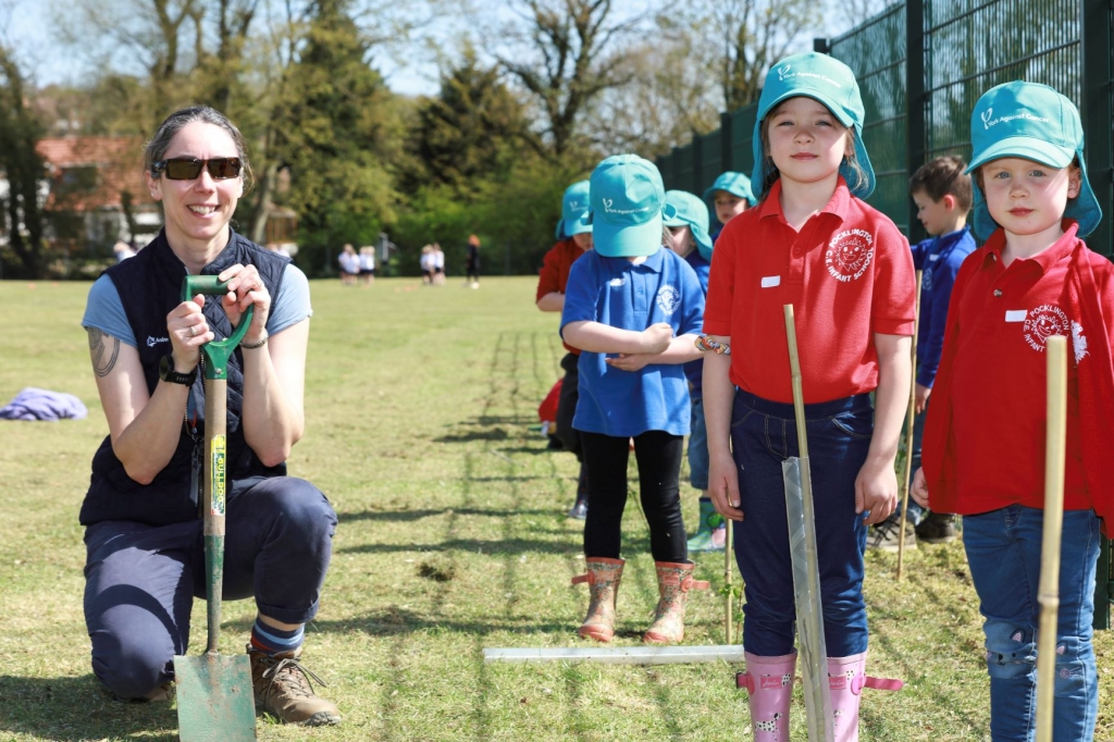 Felicity Caddick with some of the children during the tree-planting