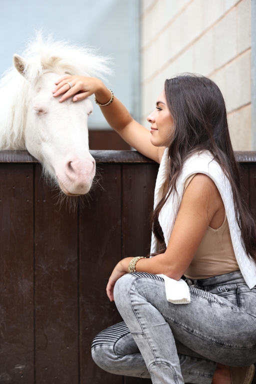 Gemma Owen meeting one of the ponies at World Horse Welfare's Penny Farm Rescue and Rehabilitation Centre