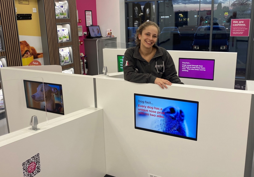 Rosie Levene-Barry from Harrison Family Vets in Kingswinford smiling inside office cubicle