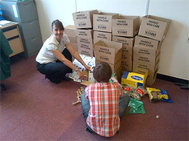 Wendy Nevins getting help packing the first of the Welfare boxes for the dogs