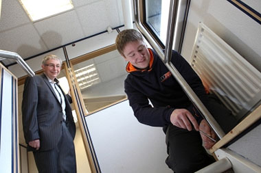 Stuart Anderson, Managing Director of Wilkinson Maintenance, looks on as apprentice Chris Anderson, 19, carries out maintenance work.